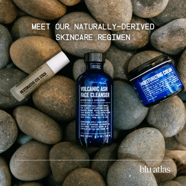 Blu Atlas ad reading Meet our naturally-derived skincare regimen, with the eye stick, face cleanser, and moisturizer on river stones