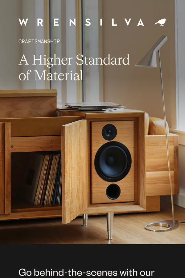 Wrensilva campaign email "A Higher Standard of Material": a walnut console and speaker in a sunlit room, a behind-the-scenes story from the Director of Wood Production with workshop photos, and a lineup of the M1, The Standard, and Studio consoles.
