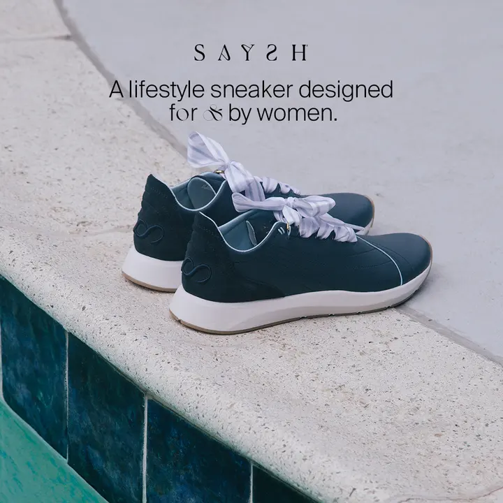 Saysh sneakers on a pool ledge